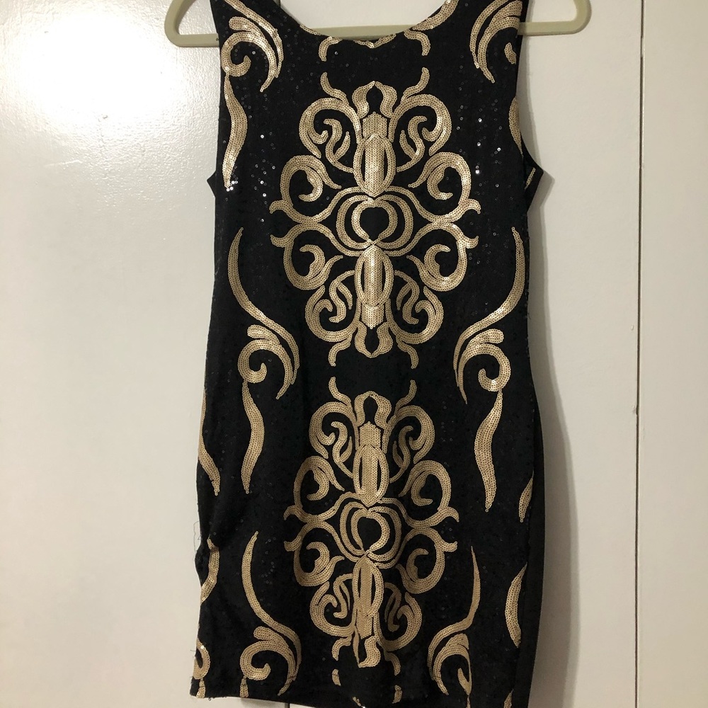 Black and gold sequin dress.